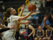 Paytin Ballard of Hudson's Bay drives to the basket during a 2A district tournament girls basketball game against Mark Morris (Tim Martinez/The Columbian)