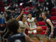 King’s Way Christian junior Giovanny Evanson (11) drives into the lane during the Knights’ 53-43 win over Seton Catholic in a 1A district third-place game at Fort Vancouver High School on Friday.