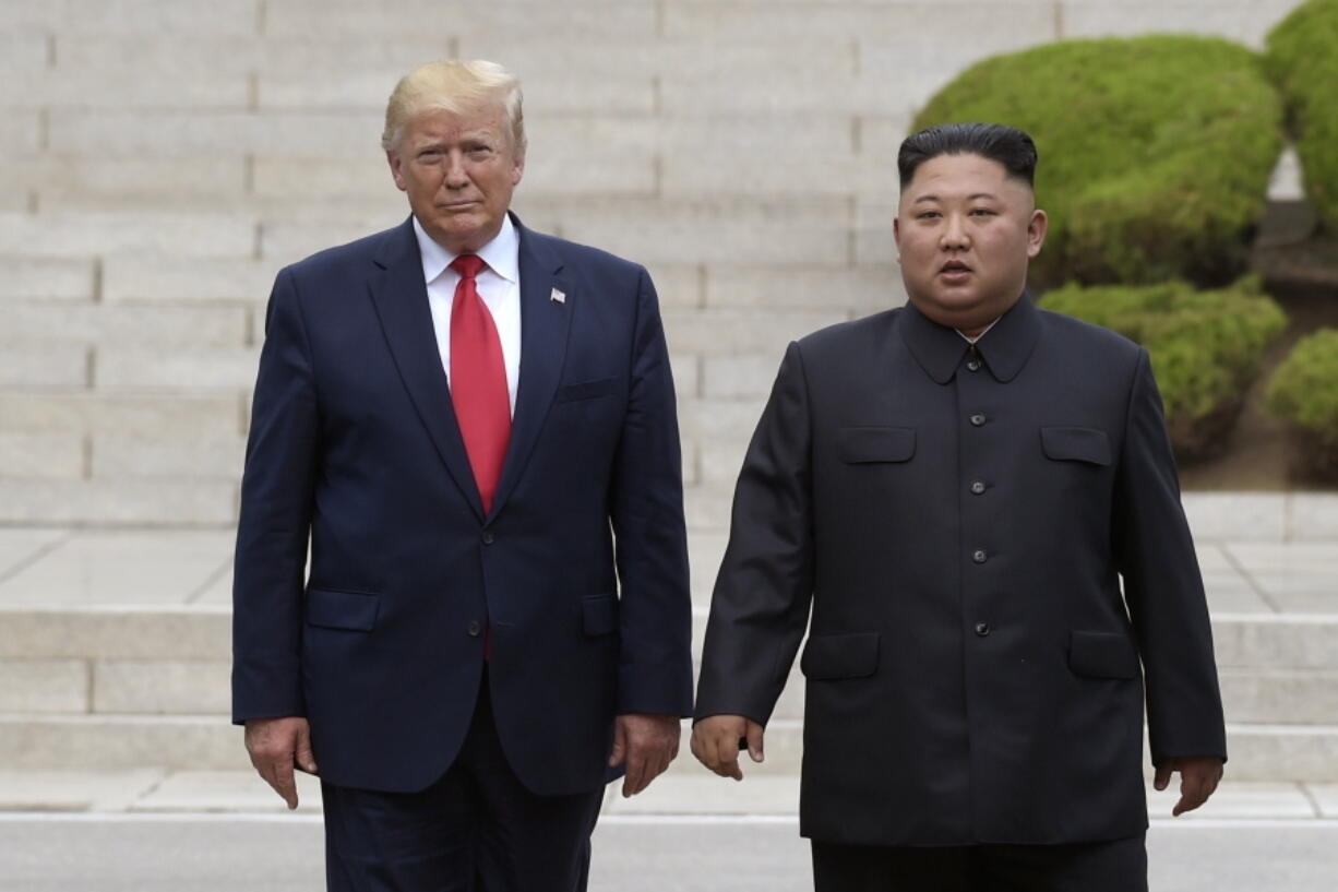 FILE - Then U.S. President Donald Trump, left, meets with North Korean leader Kim Jong Un at the North Korean side of the border at the village of Panmunjom in Demilitarized Zone, on June 30, 2019. Former President Trump has criticized the Biden administration over its handling of North Korea, insisting that the country's spree of missile tests in recent weeks wouldn't have happened if he was still in office. Trump spoke in a recorded video message that was screened on Sunday, Feb. 13, 2022, at a church forum.