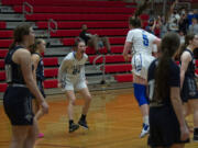 La Center’s Kylee Stephens shouts as she celebrates with teammate Gianna D’Emilio (5) after the final buzzer sounds during the Wildcats’ 57-38 win over the Knights in a district winner-to-state girls basketball game at Fort Vancouver.