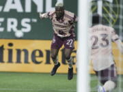 Portland Timbers midfielder Dairon Asprilla (27) celebrates after scoring a goal against the New England Revolution during the second half of an MLS soccer match, Saturday, Feb. 26, 2022, in Portland, Ore.