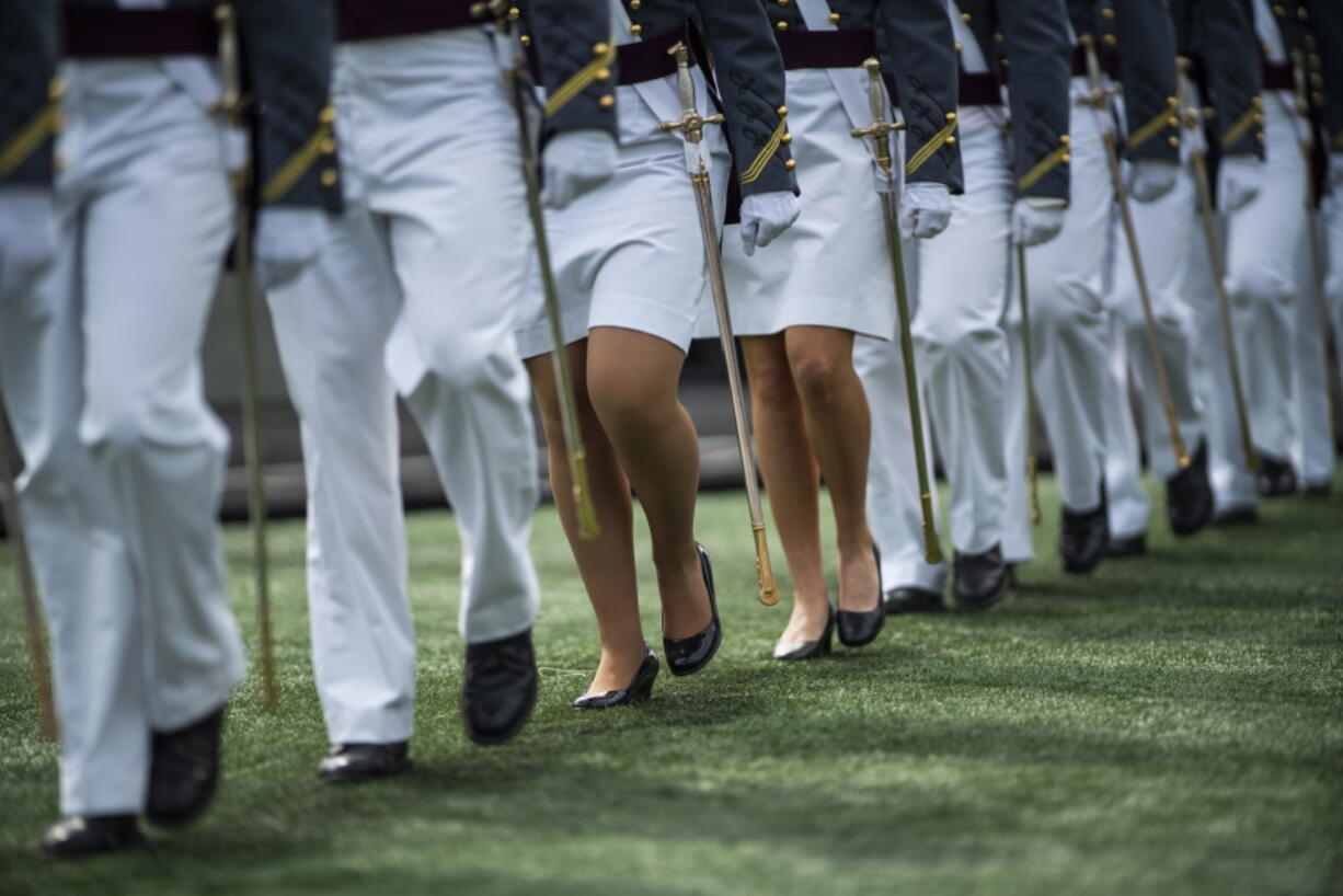 FILE - United States Military Academy graduating cadets march to their graduation ceremony of the U.S. Military Academy class 2021 at Michie Stadium on May 22, 2021, in West Point, N.Y. U.S. officials say reported sexual assaults at the U.S. military academies increased sharply during the 2020-2021 school year, as students returned to in-person classes amid the ongoing pandemic. The increase continues what officials believe is an upward trend at the academies, despite an influx of new sexual assault prevention and treatment programs.