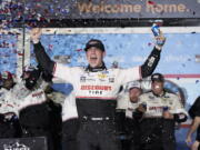 Austin Cindric celebrates in Victory Lane after winning the NASCAR Daytona 500 auto race at Daytona International Speedway, Sunday, Feb. 20, 2022, in Daytona Beach, Fla.