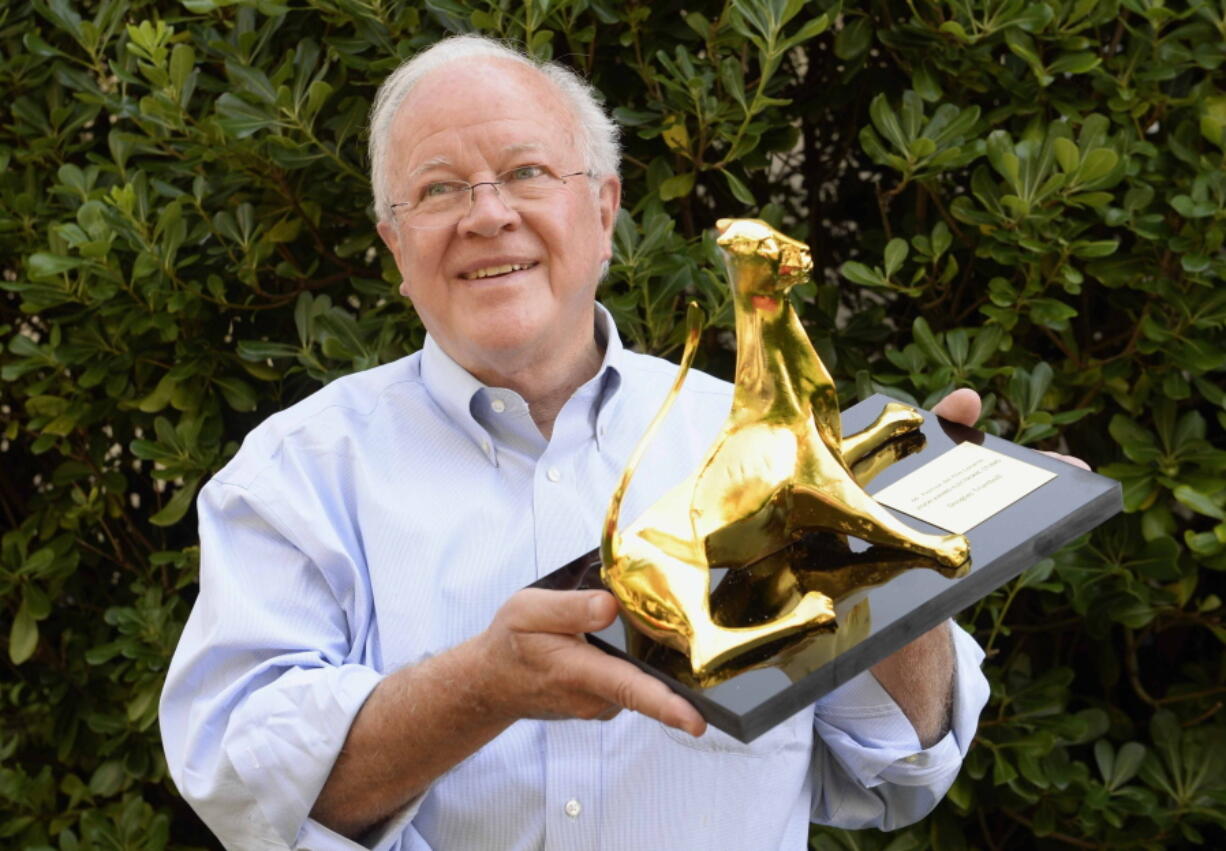 FILE - U.S. film director and special effects supervisor Douglas Trumbull poses with the Film Vision Award Pardo at the 66th Locarno International Film Festival in Locarno, Switzerland on Aug. 14, 2013. Trumbull, a visual effects master who showed movie audiences indelible images of the future and of space in films like "2001: A Space Odyssey," "Close Encounters of the Third Kind" and "Blade Runner,"  died  Monday, Feb. 7, 2022, of complications from mesothelioma. He was 79.