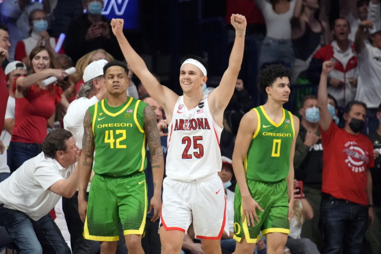 Arizona guard Kerr Kriisa (25) celebrates the team's 84-81 win over Oregon during an NCAA college basketball game, Saturday, Feb. 19, 2022, in Tucson, Ariz.