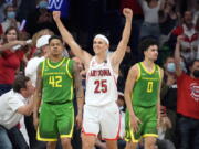 Arizona guard Kerr Kriisa (25) celebrates the team's 84-81 win over Oregon during an NCAA college basketball game, Saturday, Feb. 19, 2022, in Tucson, Ariz.