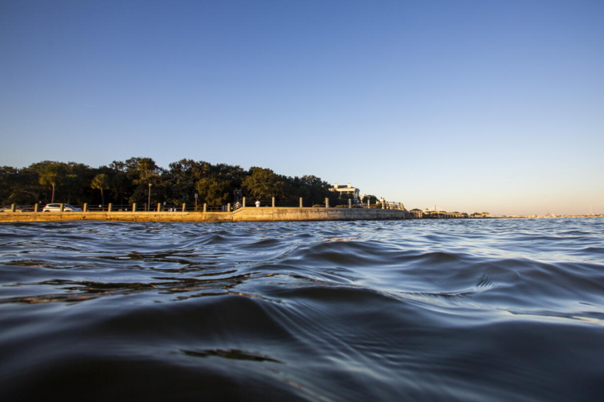 High tide laps against the sea wall at The Battery in Charleston, S.C., in November 2020.