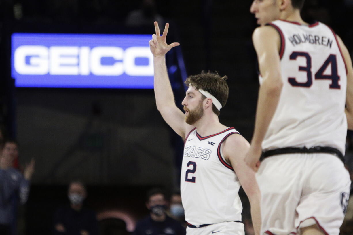 Gonzaga forward Drew Timme (2) celebrates his 3-point basket during the first half of the team's NCAA college basketball game against Santa Clara, Saturday, Feb. 19, 2022, in Spokane, Wash.