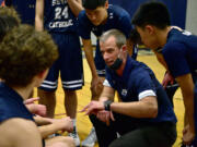 Seton Catholic boys basketball coach Aaron Jenniges talks to the team between quarters Tuesday, Feb. 1, 2022, during the Cougars’ 32-23 loss to the Knights at King’s Way Christian High School.