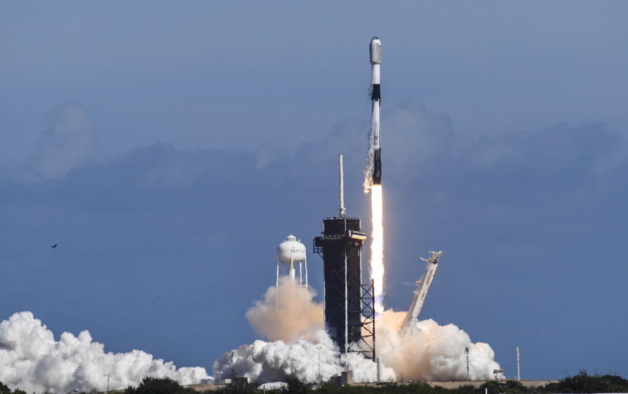 FILE - A SpaceX Falcon 9 rocket lifts off from Pad 39A at Kennedy Space Center, Fla.,Thursday, Feb. 3, 2022. The rocket is carrying a batch of Starlink satellites. Spacex's newest fleet of Starlink satellites are tumbling out of orbit because of a geomagnetic storm. In an online update Tuesday, Feb. 8, Elon Musk's company reported that up to 40 of the 49 small Internet-service satellites launched last Thursday have either re-entered the atmosphere and burned up, or are on the verge of doing so.