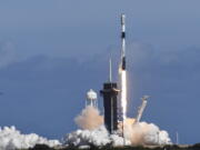 FILE - A SpaceX Falcon 9 rocket lifts off from Pad 39A at Kennedy Space Center, Fla.,Thursday, Feb. 3, 2022. The rocket is carrying a batch of Starlink satellites. Spacex's newest fleet of Starlink satellites are tumbling out of orbit because of a geomagnetic storm. In an online update Tuesday, Feb. 8, Elon Musk's company reported that up to 40 of the 49 small Internet-service satellites launched last Thursday have either re-entered the atmosphere and burned up, or are on the verge of doing so.