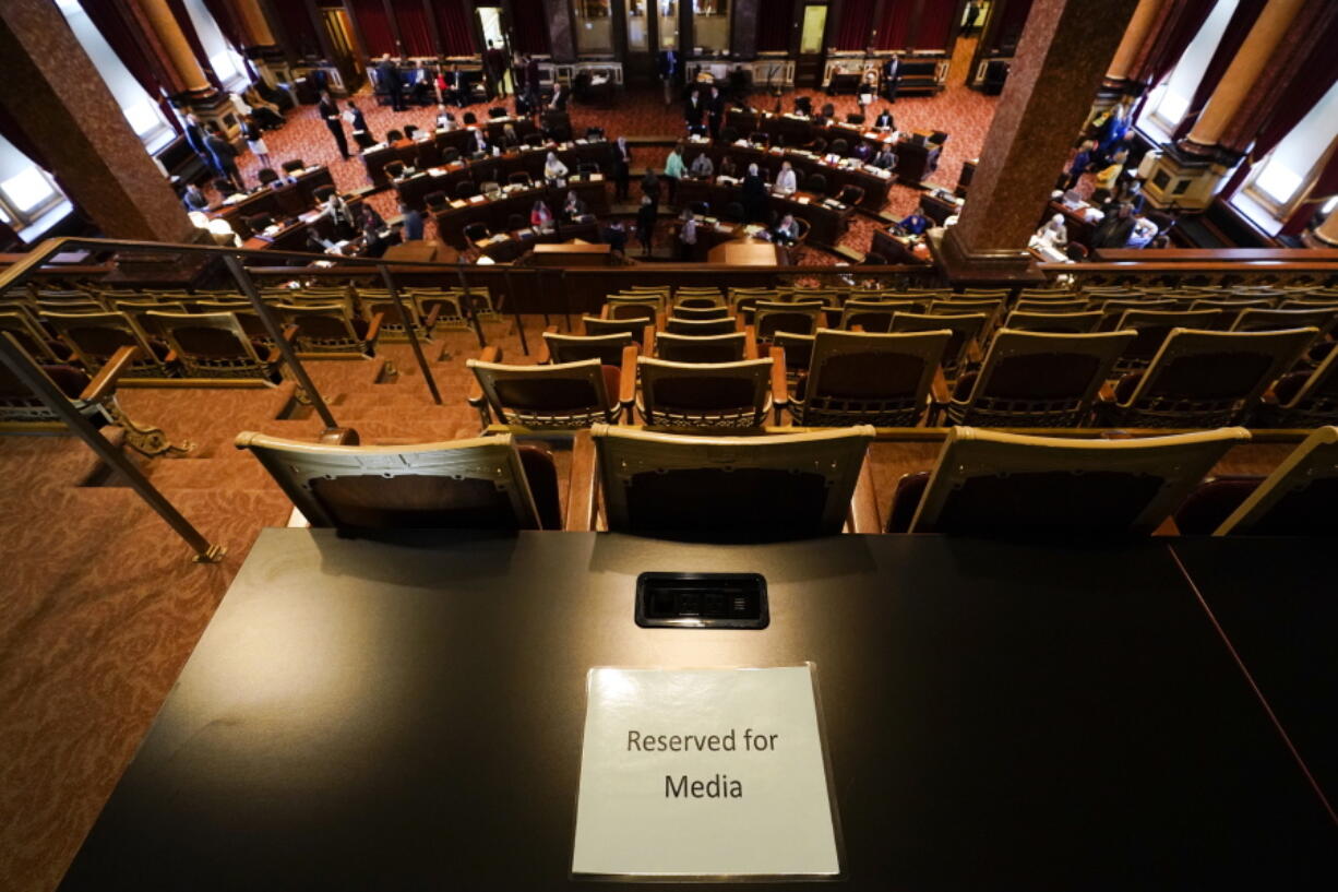 FILE - A Reserved for Media sign sits on a table in the Iowa Senate gallery during the opening day of the Iowa Legislature on Jan. 10, 2022, at the Statehouse in Des Moines, Iowa. Utah's state Senate passed rules this week limiting where the press can go to report in statehouses, marking the latest move by Republican state lawmakers departing from centuries-old traditions to make pandemic-era limits on access to chambers permanent. Rules governing where journalists can work vary across the nation's 50 statehouses. But in states such as Utah, Kansas and Iowa, reporters accustomed to reporting from the floor of legislative chambers are being restricted to public galleries.