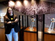 Seattle Storm guard Sue Bird poses for a photo with team championship trophies after a news conference where she talked about her return for one more WNBA basketball season Tuesday, Feb. 22, 2022, in Seattle. Bird, a four-time WNBA champion, 12-time All-Star selection and the oldest player in the league at 41, said all signs are pointing toward the 2022 season being her last in the WNBA, but does not want the upcoming season to be a farewell tour.