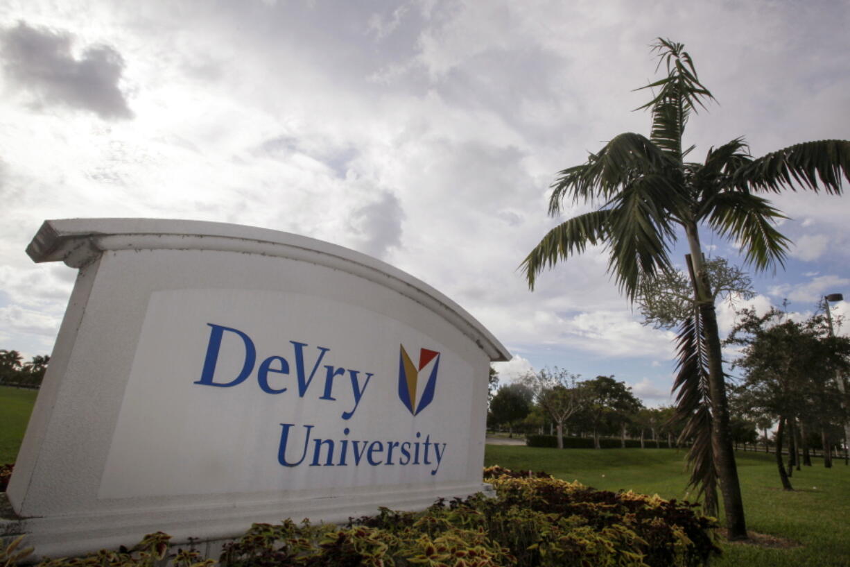 FILE - This Nov. 24, 2009, photo, shows the entrance to the DeVry University in Miramar, Fla. The Biden administration says it will cancel more than $70 million in student debt for borrowers who say they were defrauded by the for-profit DeVry University. It marks the first time the Education Department has approved such claims for an institution that's still in operation.