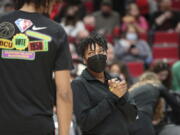 Portland Trail Blazers assistant coach Edniesha Curry talks with forward Greg Brown prior to an NBA basketball game against the New York Knicks in Portland, Ore., Saturday, Feb. 12, 2022. Curry is one of just six women currently working as assistants in the NBA and the first to work in that capacity for the Blazers.