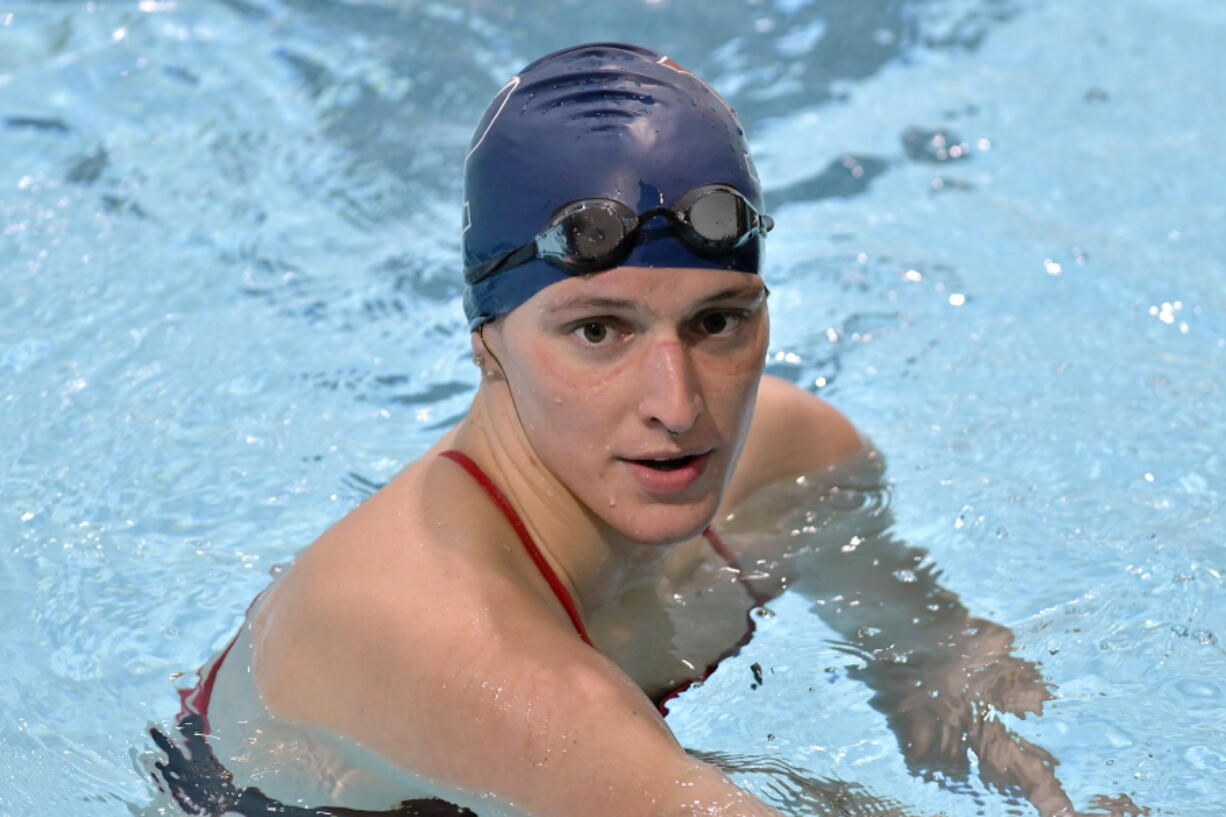 FILE - University of Pennsylvania transgender swimmer Lia Thomas speaks to her coach after winning the 500 meter freestyle during an NCAA college swimming meet with Harvard, Jan. 22, 2022, at Harvard University in Cambridge, Mass. Thomas is the subject of an attack ad by Congresswoman Vick Hartzler, a U.S. Senate candidate in Missouri.