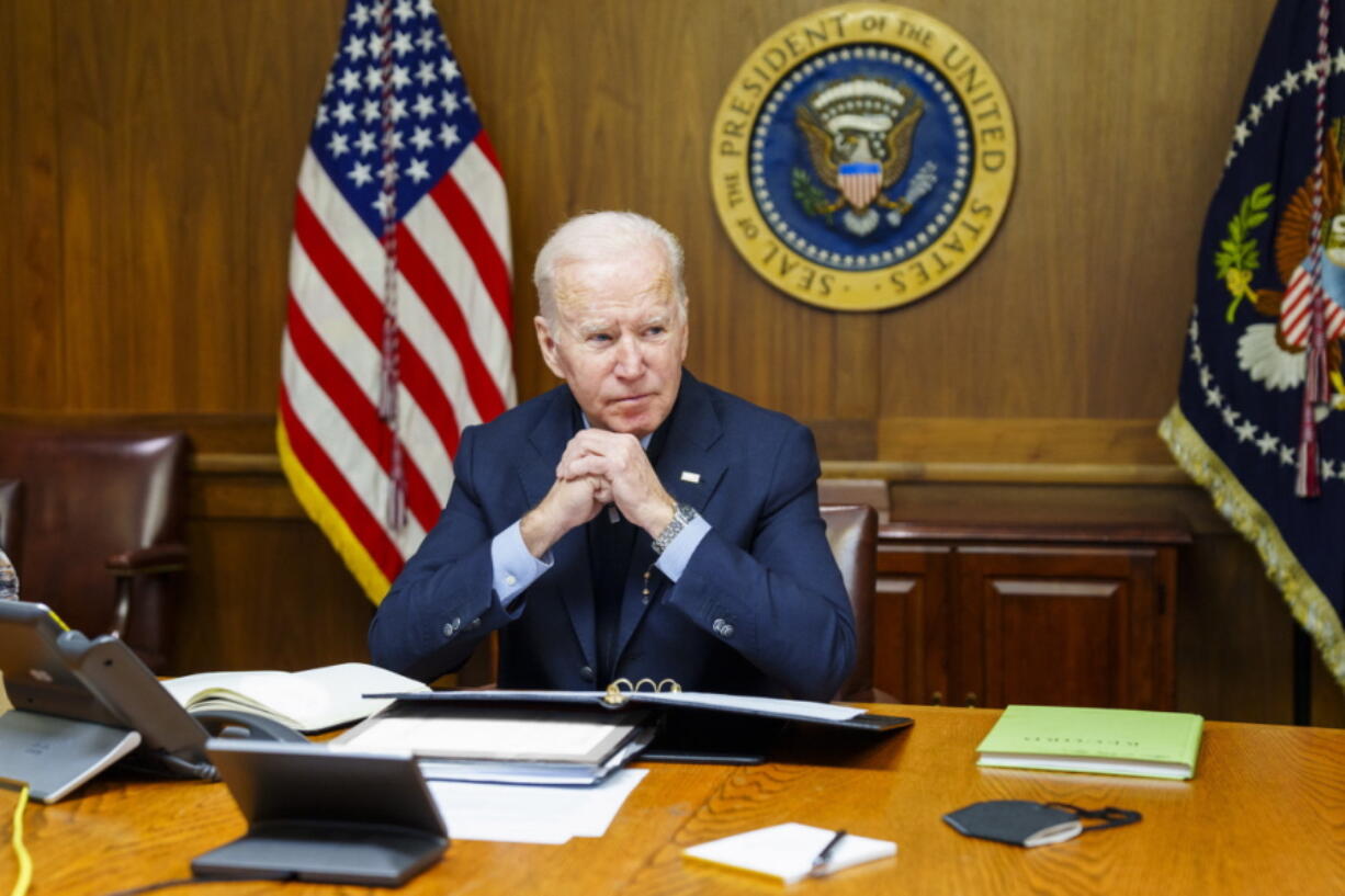 This image provided by The White House via Twitter shows President Joe Biden at Camp David, Md., Saturday, Feb. 12, 2022. Biden on Saturday again called on President Vladimir Putin to pull back more than 100,000 Russian troops massed near Ukraine's borders and warned that the U.S. and its allies would "respond decisively and impose swift and severe costs" if Russia invades, according to the White House.