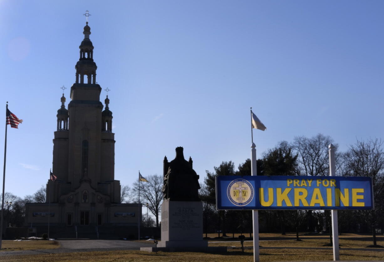 A sign outside St. Andrew Ukrainian Orthodox Memorial Church in South Bound Brook, N.J., reads, "Pray for Ukraine," Wednesday, Feb. 9, 2022. Religious leaders and members of the Ukrainian diaspora in the United States are growing increasingly alarmed over the threat of a Russian invasion to Ukraine and have stepped efforts to help their family members back home.