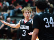 Union's Bryson Metz gives instruction to teammate Yanni Fassilis in a 4A Greater St. Helens League boys basketball on Tuesday, Feb. 8, 2022, at Camas High School. Camas won 80-77.