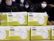 Shown are KN95 protective masks before being distributed to students at Camden High School in Camden, N.J., Wednesday, Feb. 9, 2022. As the omicron wave of the coronavirus subsides, several U.S. states including New York and Illinois ended mask mandates this week for indoor settings, while others lifted requirements at schools.