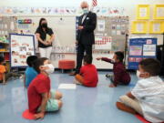 FILE -- New Jersey Gov. Phil Murphy talks to three and four year old students in a pre-K class at the Dr. Charles Smith Early Childhood Center, Sept. 16, 2021, in Palisades Park, N.J. Murphy will end a statewide mask mandate to protect against COVID-19 in schools and child care centers, his office said Monday, Feb 7, 2022.