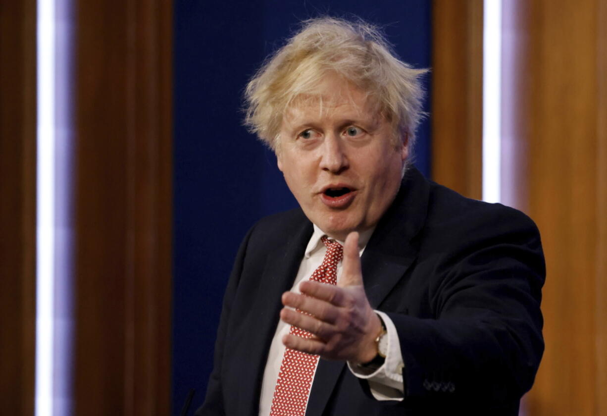 Britain's Prime Minister Boris Johnson speaks during a media briefing in Downing Street, London,  Monday Feb. 21, 2022, to outline the Government's new long-term COVID-19 plan.