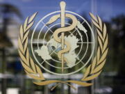 FILE - The logo of the World Health Organization is seen at the WHO headquarters in Geneva, Switzerland, June 11, 2009. The World Health Organization chief on Tuesday, Feb. 1, 2022 says 90 million cases of coronavirus have been reported since the omicron variant was first identified 10 weeks ago, amounting to more than in all of 2020, the first year of the COVID-19 pandemic.