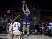 Washington guard Cole Bajema (22) shoots over California guard Joel Brown (1) and guard Makale Foreman (10) during the first half of an NCAA college basketball game Thursday, Feb. 3, 2022, in Berkeley, Calif.