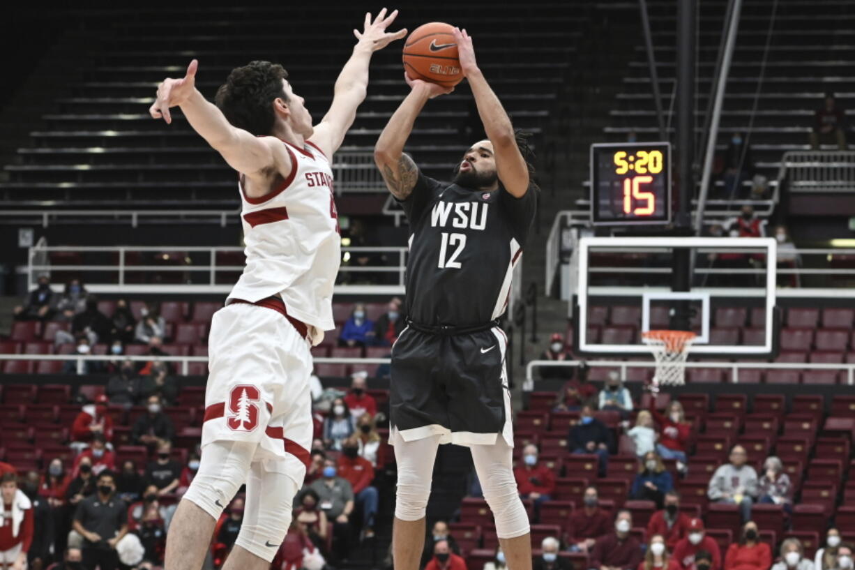 Stanford forward Maxime Raynaud (42) defends against Washington State guard Michael Flowers (12) during the second half of an NCAA college basketball game in Stanford, Calif., Thursday, Feb. 3, 2022.