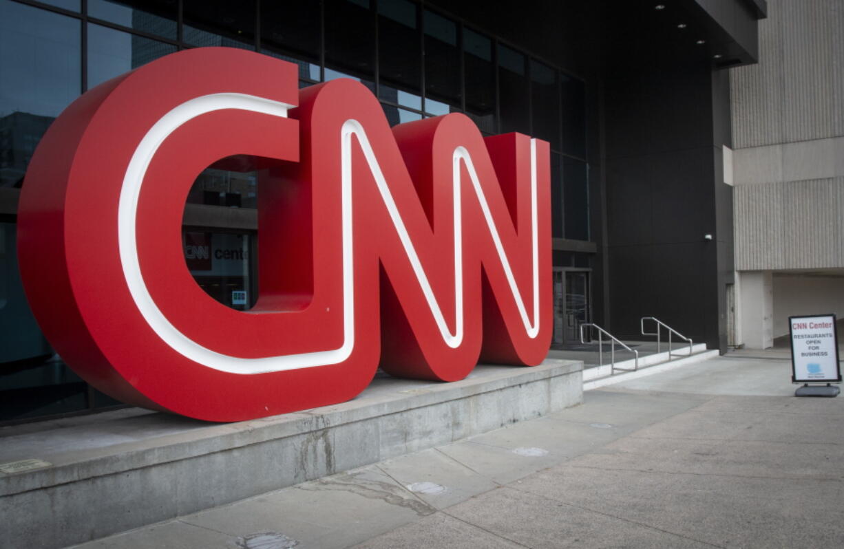 The CNN logo is displayed at the entrance to the CNN Center in Atlanta on Wednesday, Feb. 2, 2022. CNN's Jeff Zucker's abrupt exit this week after failing to disclose a workplace relationship is yet another reminder that companies should have a firm policy in place when workplace relationships arise, even in the C-Suite.