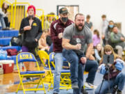 Stevenson boys wrestling coach yells in celebration during the 1B/2B Region 1 boys wrestling tournament at Adna on Saturday.