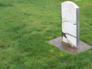 The gravestone of early Washougal settler Richard Ough is displayed in the pioneer section of the Washougal Memorial Cemetery.