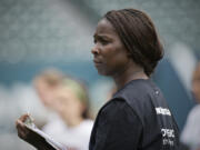 Tina Ellertson coaches during a Thorns Youth Academy at Providence Park on Tuesday July 22, 2014.