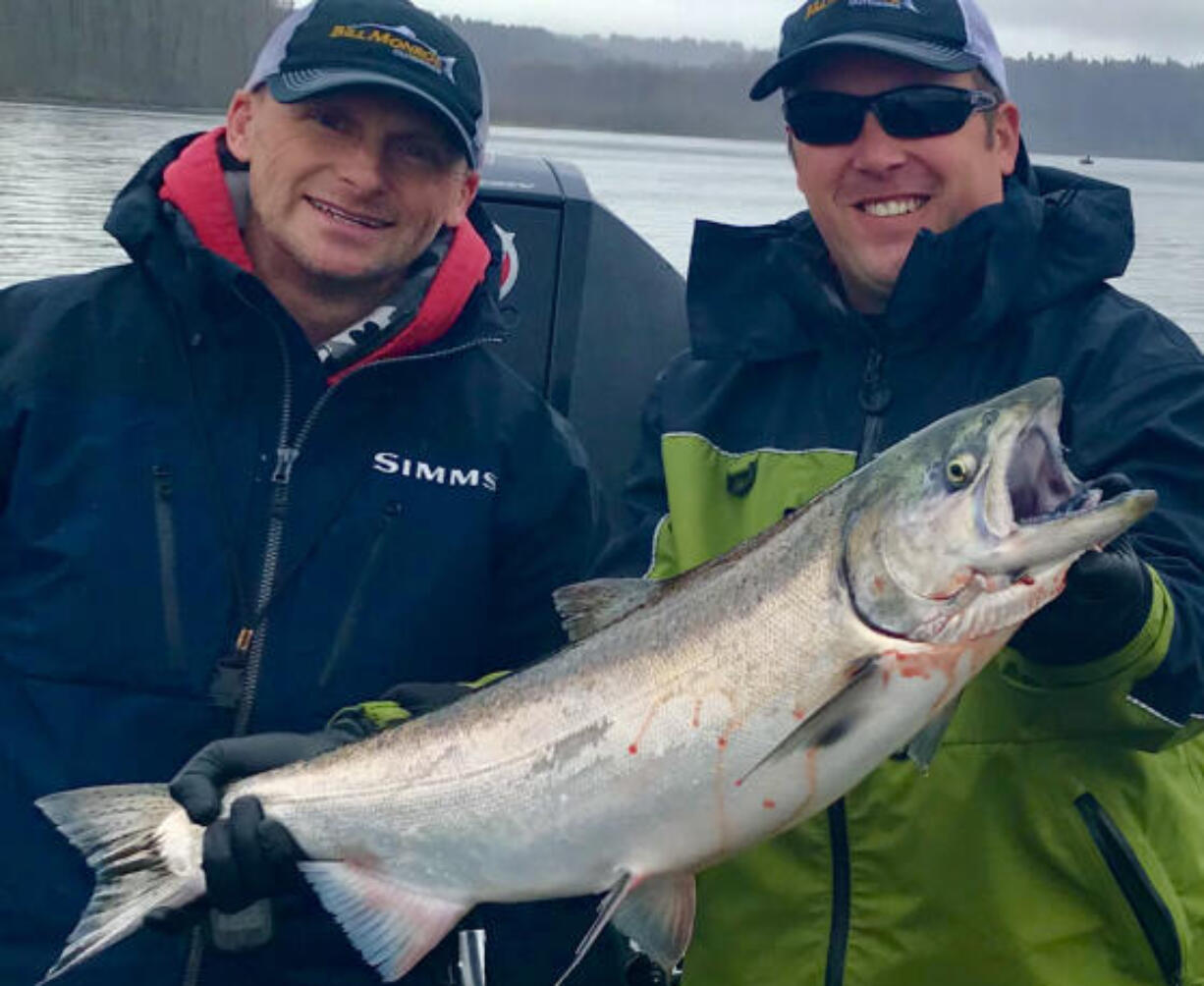 Guide Bill Monroe, (left), with a client and a nice spring Chinook caught in the Columbia River during last year's spring salmon fishery. Projections for the spring Chinook run are up this year, and anglers should see better fishing than the past few years.