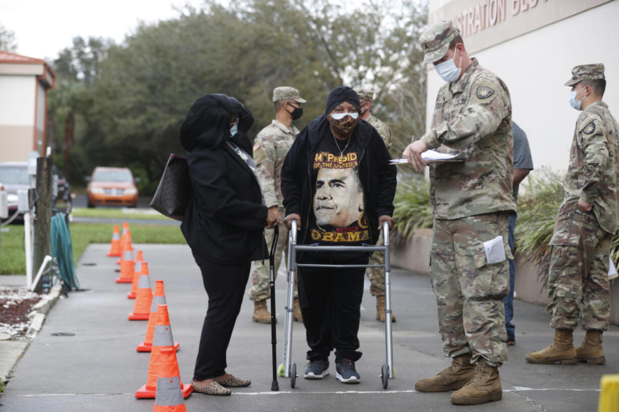 Bible-Based Fellowship Church partners with the Pasco County Health Department, and Army National Guard to assist residents who are 65 and older to administer the Moderna COVID-19 vaccine on Feb. 13, 2021, in Tampa, Florida.