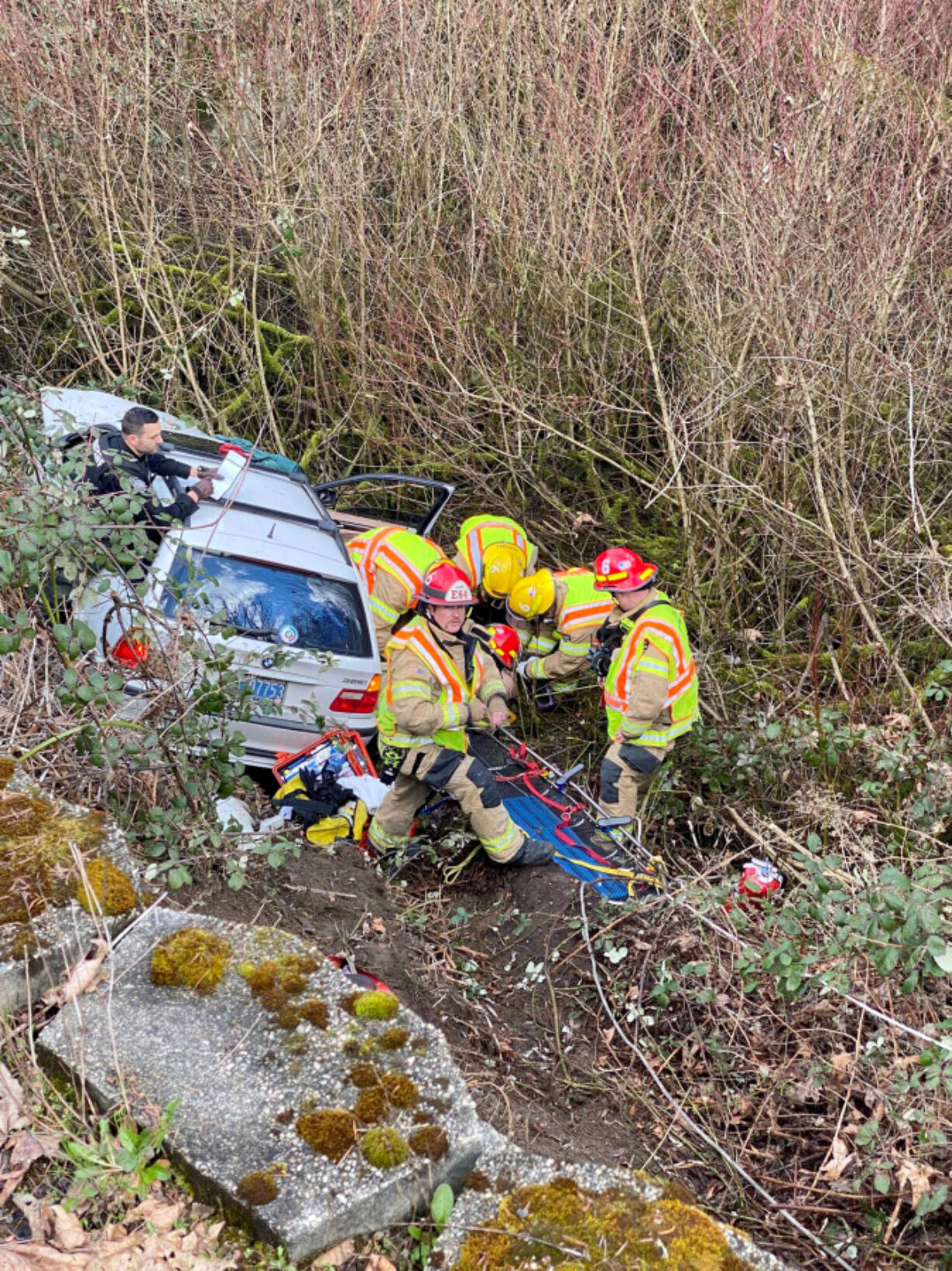 Clark County Fire District 6 crews rescue a man Wednesday afternoon whose vehicle veered off Highway 99 in Salmon Creek, crashed into a power pole and fell 25 feet into a gully.