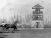 A harness racer sprints on Vancouver's racetrack in 1898, speeding by the judging stand designed by O.M. Hidden. The track opened in 1892 and operated on and off until 1911. In 1913, local racing started a second time at the old fairgrounds east of Burnt Bridge Creek in today's Bagley Downs neighborhood.