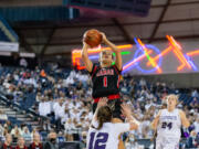 Camas' Reagan Jamison commits an offensive foul as she goes up for a shot in a 4A State Girls Basketball quarterfinal game on Thursday, March 3, 2022, at the Tacoma Dome.