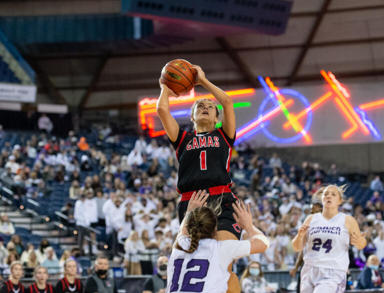 Camas' Reagan Jamison commits an offensive foul as she goes up for a shot in a 4A State Girls Basketball quarterfinal game on Thursday, March 3, 2022, at the Tacoma Dome.