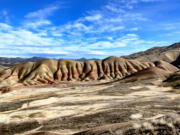 The strangely shapely Painted Hills of the John Day Fossil Beds catch the best light at sunset.