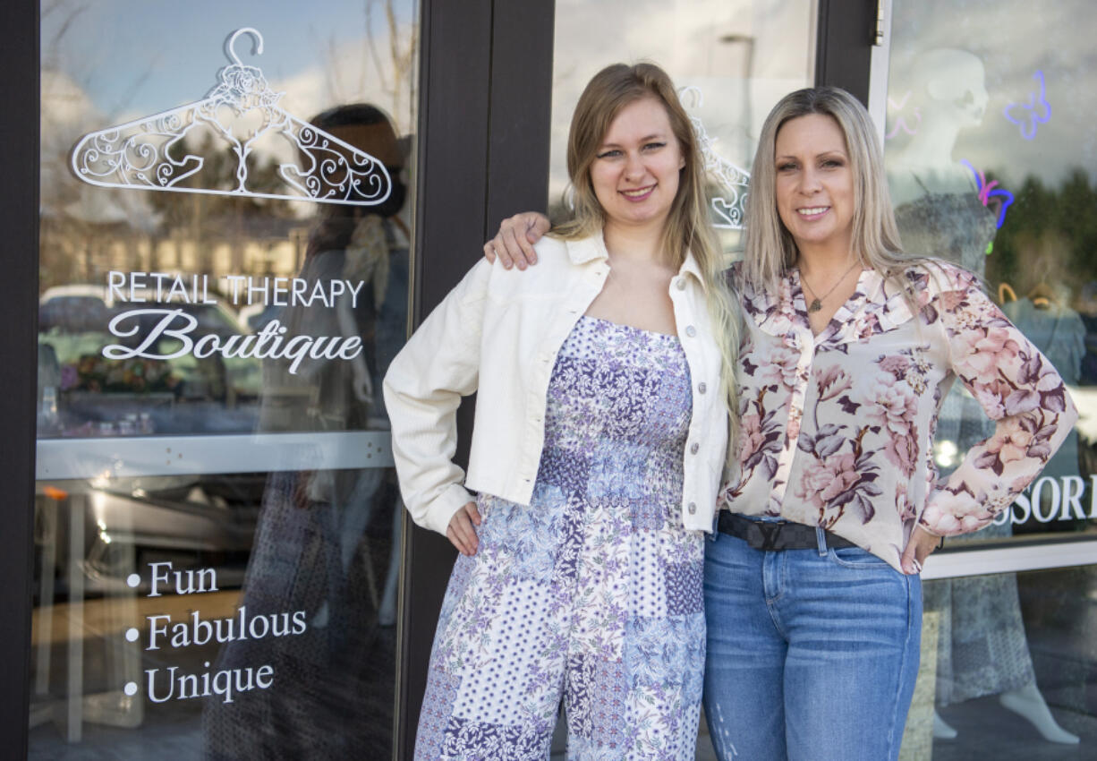 Mother-daughter duo and co-owners of Retail Therapy Boutique, Shanya Giese, right, and Hailey Giese, pose for a portrait outside their store in east Vancouver.