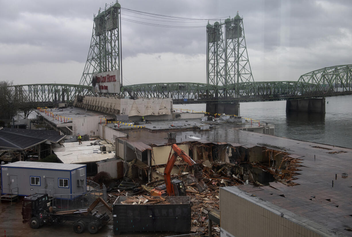 Demolition crews tear into a section of the former Red Lion at the Quay on Tuesday morning. The building's demolition will take four to six weeks.