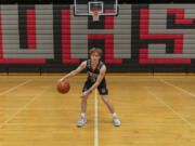 Union senior Bryson Metz stands for a portrait Wednesday, March 16, 2022, at the Union High School gym. Metz is The Columbian's All-Region boys basketball player of the year.