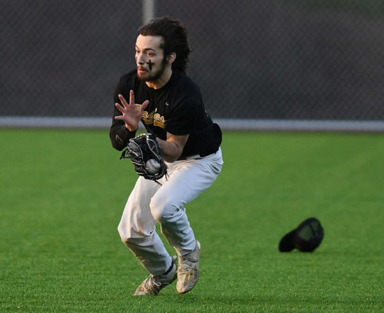 Hudson's Bay outfielder Dylan Damos makes a running catch during the Eagles's 5-3 win against Evergreen at the new Evergreen Sports Complex.