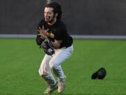 Hudson's Bay outfielder Dylan Damos makes a running catch during the Eagles's 5-3 win against Evergreen at the new Evergreen Sports Complex.