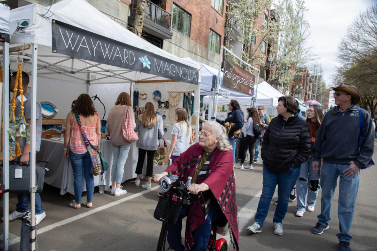 Visitors browse Saturday at the Vancouver Farmers Market.