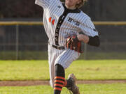 Battle Ground's Zach Hauser pitches in a 4A/3A Greater St. Helens League baseball game on Thursday, March 24, 2022, at Prairie High School. Battle Ground won 2-0.