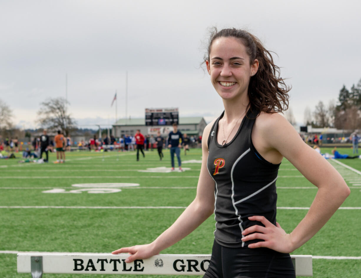 Prairie's Kara Mattson pauses for a moment to pose for a portrait at the Tiger Invite on Saturday, March 26, 2022, at Battle Ground High School.