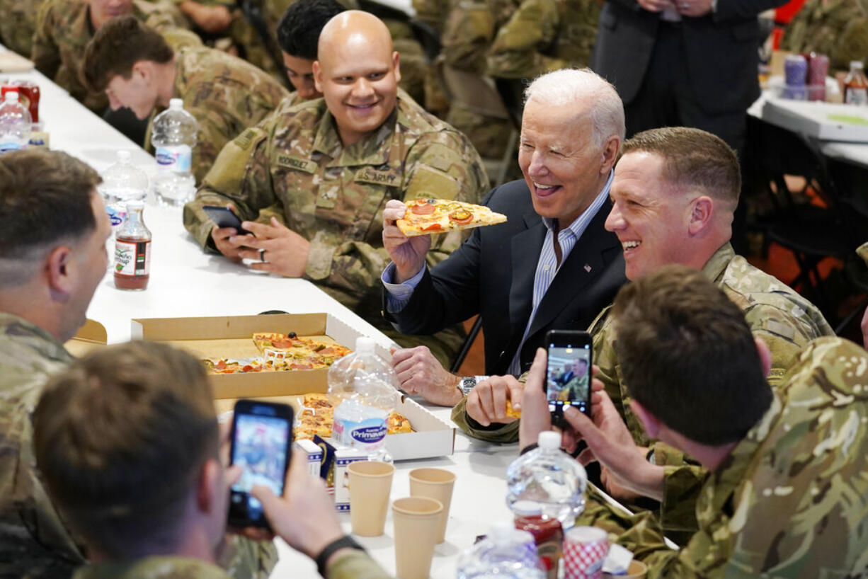 President Joe Biden visits with members of the 82nd Airborne Division at the G2A Arena, Friday, March 25, 2022, in Jasionka, Poland.