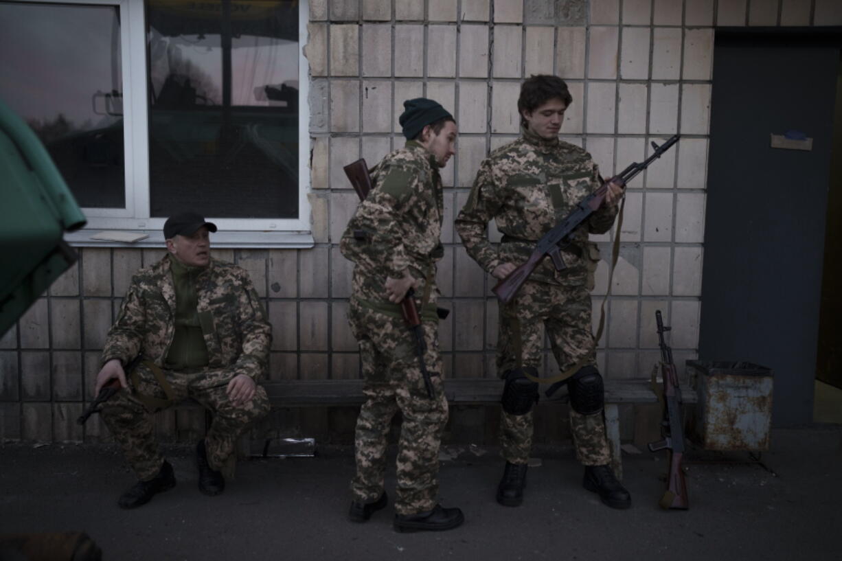 Civilian volunteers attend a training camp of the Ukrainian Territorial Defense Forces in Brovary, northeast of Kyiv, Ukraine, Monday, March 21, 2022.